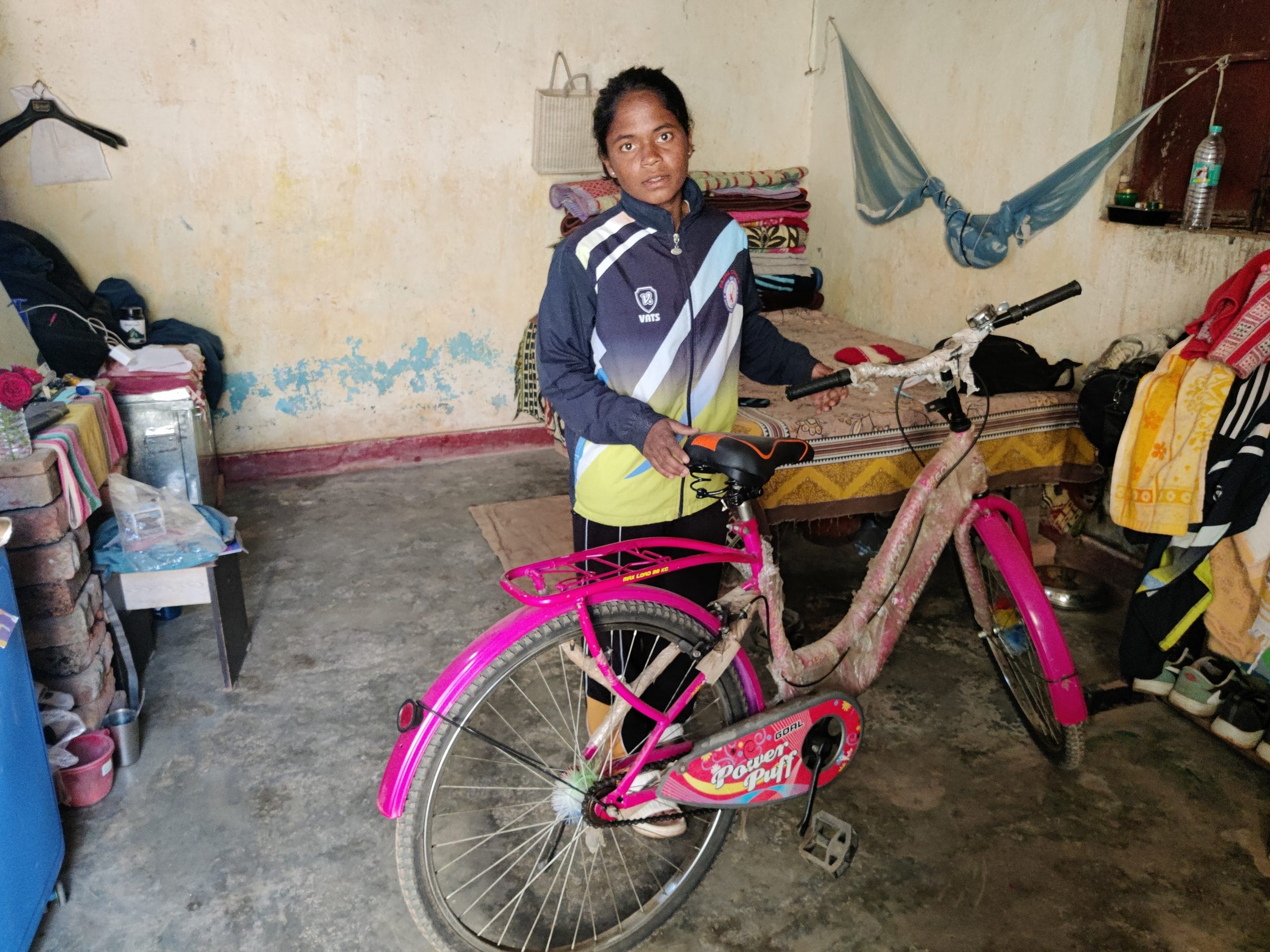 Anushka with the cycle she received from the district administration, making daily travel easier as her training commitments increase | Photo: Almina Khatoon | ThePrint