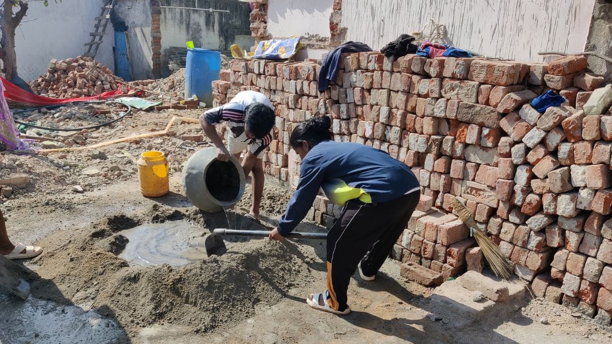 Even after national recognition, Anushka helps her family at the construction site—mixing cement and carrying materials with her elder brother.
