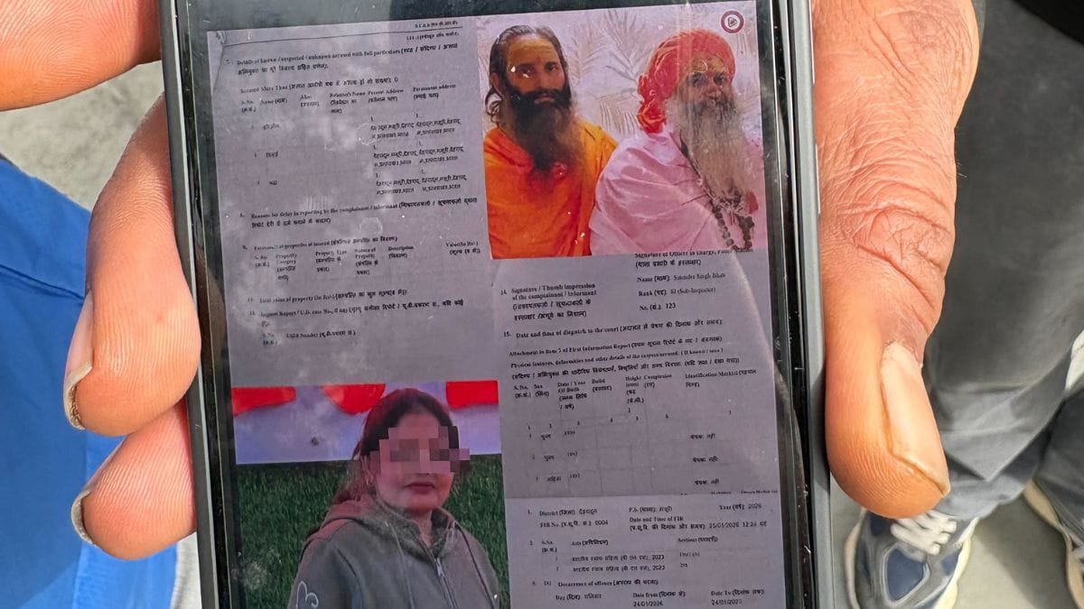 Local residents showing the photos of the perpetrators that police have identified so far. None of them have been arrested