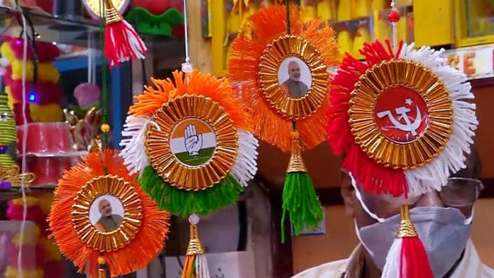 Representational image: File photo of party symbols and party colors of Congress, BJP and CPI(M) in Kochi | ANI