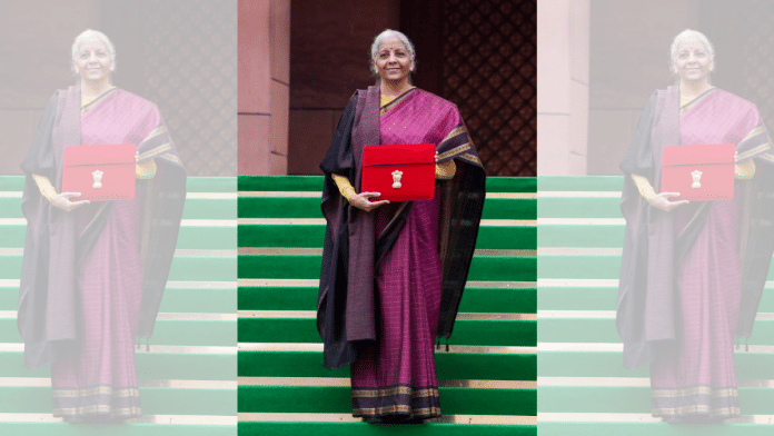 Finance Minister Nirmala Sitharaman shows the digital tablet, enclosed in a traditional red 'bahi-khata' style pouch, at the Parliament premises before the presentation of the Union Budget 2026-27, in New Delhi, Sunday, Feb. 1, 2026. | PTI Photo/Ravi Choudhary