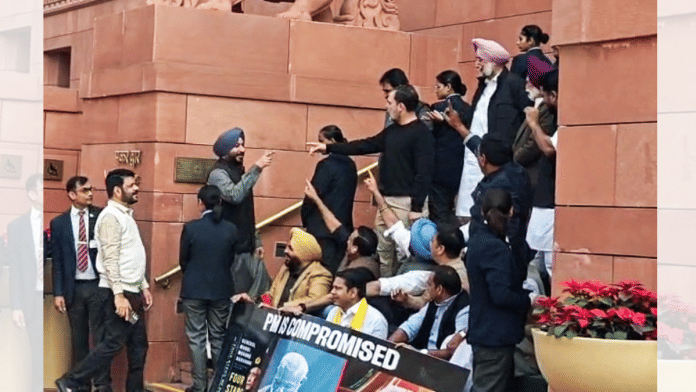 Lok Sabha LoP Rahul Gandhi with suspended Lok Sabha MPs during a protest at the Parliament, in New Delhi on Wednesday. (ANI Video Grab)
