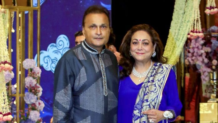Indian businessman Anil Ambani and his wife Tina Ambani pose for a photo as they arrive to attend the Shiv Shakti Pooja ahead of the wedding of Reliance Industries Chairman Mukesh Ambani's son Anant Ambani with Industrialist Viren Merchant's daughter Radhika Merchant, at Antilla in Mumbai on Wednesday. (ANI Photo)