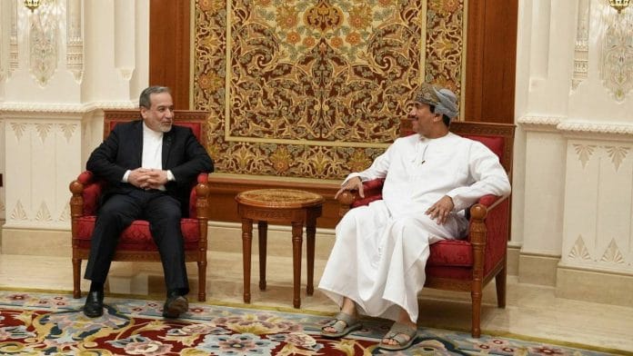 Iran's Foreign Minister Abbas Araghchi is welcomed by an Omani official upon his arrival in Muscat, Oman, in this handout image obtained on February 6, 2026. Iranian Foreign Ministry/WANA (West Asia News Agency)/Handout via REUTERS