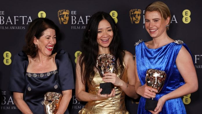 Jessie Buckley, director Chloe Zhao and Dame Pippa Harris pose with the Best Leading Actress Award and Outstanding British Film Award for 