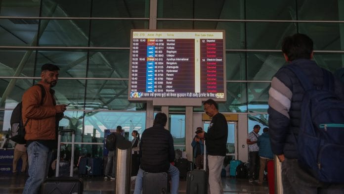 A screen showing cancelled Indigo Airlines flights inside Terminal 1 of Indira Gandhi International Airport in New Delhi on Dec. 05, 2025.