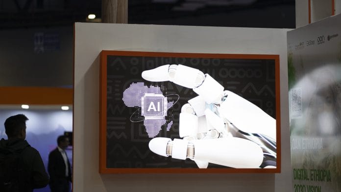 An artificial intelligence display during the AI Impact Summit in New Delhi, India, on Wednesday, Feb. 18, 2026. India kicked off one of the worlds largest artificial intelligence summits this week as Prime Minister Narendra Modi seeks to make the country an AI hub amid intense competition to develop frontier models | Bloomberg