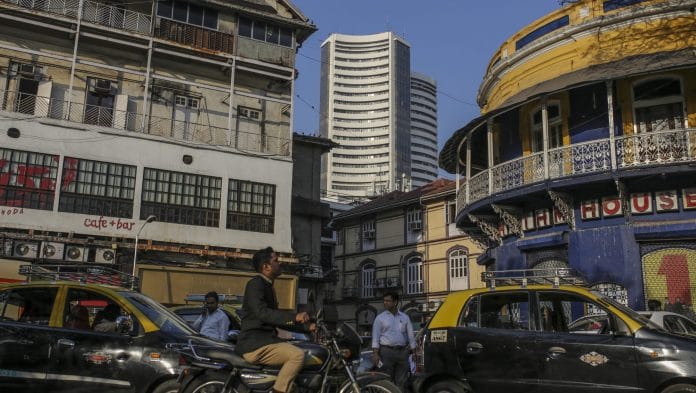 Traffic and pedestrians pass the Bombay Stock Exchange (BSE) building, center, in Mumbai, India | Bloomberg