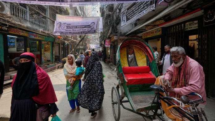 Bangladeshi Muslim women walk on a street on the eve of national election in Dhaka, Bangladesh, Tuesday, Feb. 10, 2026. AP/PTI(AP02_10_2026_000244B)