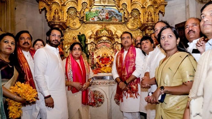In this image posted on Feb. 10, 2026, Maharashtra Deputy Chief Minister Sunetra Pawar with NCP MP Praful Patel during a visit to Siddhivinayak Temple, in Mumbai. (@SunetraA_Pawar/X via PTI Photo)