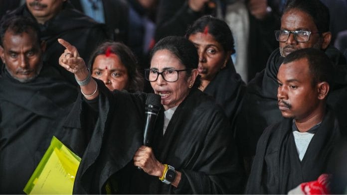 West Bengal Chief Minister Mamata Banerjee, along with families allegedly affected by the SIR process, speaks to the media after meeting Chief Election Commissioner Gyanesh Kumar, outside the Election Commission Office in New Delhi Monday. The black shawls were worn in a mark of protest | Suraj Singh Bisht | ThePrint