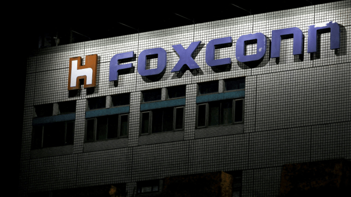 Logo of Foxconn is seen outside the company's building | Reuters