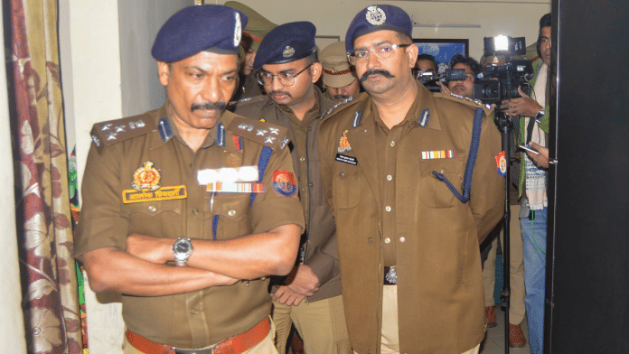 Additional Commissioners of Police Alok Priyadarshi and Keshav Kumar Choudhary at the society in Ghaziabad, on Wednesday | PTI