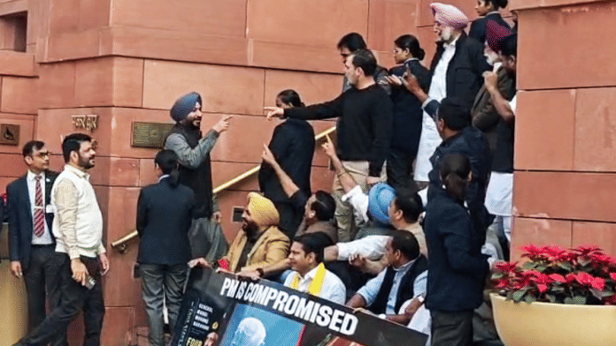 Lok Sabha LoP Rahul Gandhi exchanges barbs with Union Minister Ravneet Bittu during a protest at Parliament, on 4 February 2026 | ANI video grab