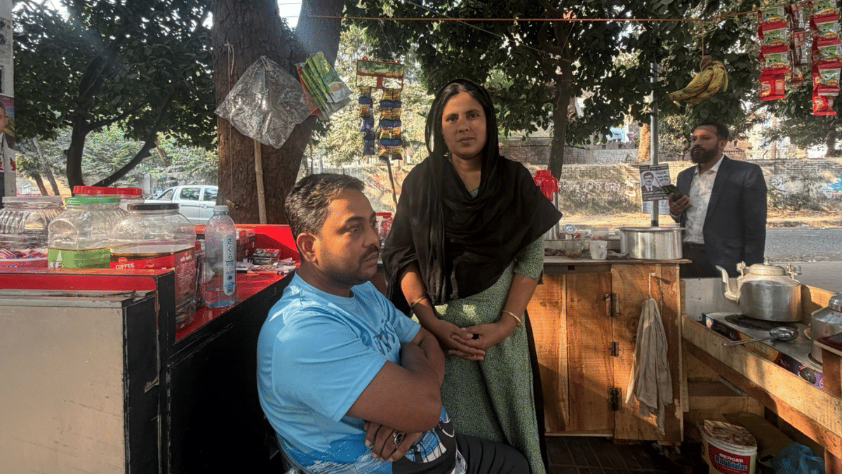 BNP worker Hasan Ali and his wife at their shop located opposite Dhanmondi-32 | Debdutta Chakraborty | ThePrint