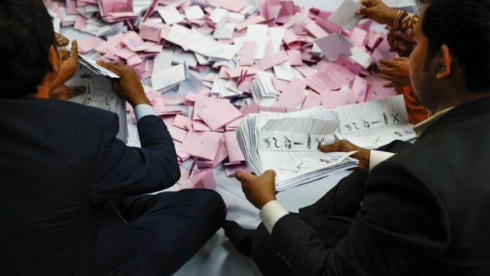 Electoral workers sorting the ballots before counting Thursday | REUTERS/Mohammad Ponir Hossain