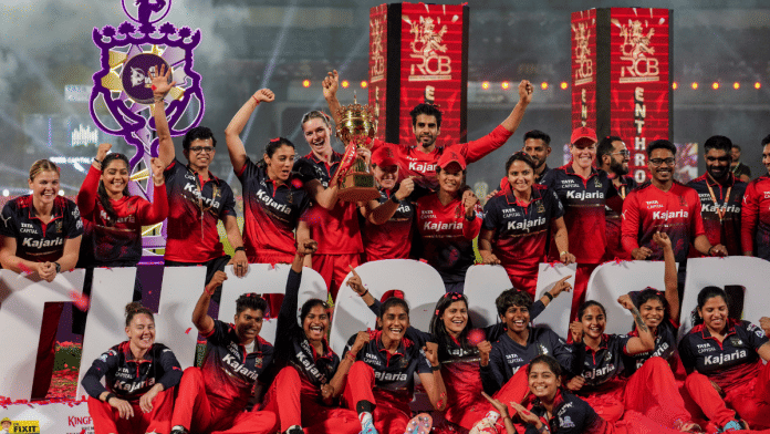 Royal Challengers Bengaluru celebrate after winning the Women's Premier League 2026 T20 final against Delhi Capitals, at Baroda Cricket Association Stadium, Kotambi in Vadodara, Gujarat | PTI