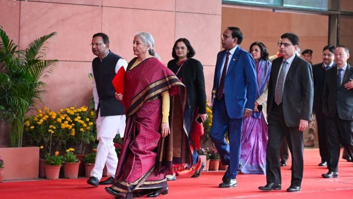 Finance Minister Nirmala Sitharaman walks ahead, with the Budget document in hand | Praveen Jain | ThePrint