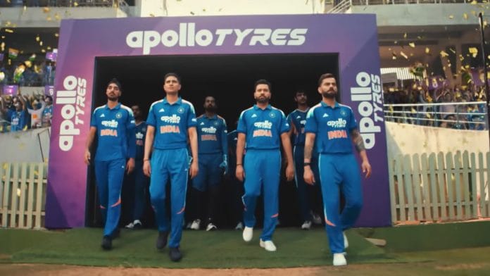 A still of Shubman Gill, Rohit Sharma, and Virat Kohli walking out of the pavillion in new Apollo Tyres' ad.
