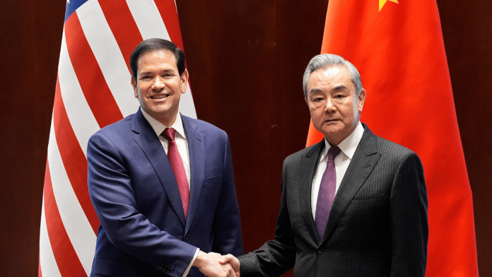 U.S. Secretary of State Marco Rubio shakes hands with China’s Foreign Minister Wang Yi in Munich, Germany, February 13, 2026, on the sidelines of the Munich Security Conference | Pool via Reuters