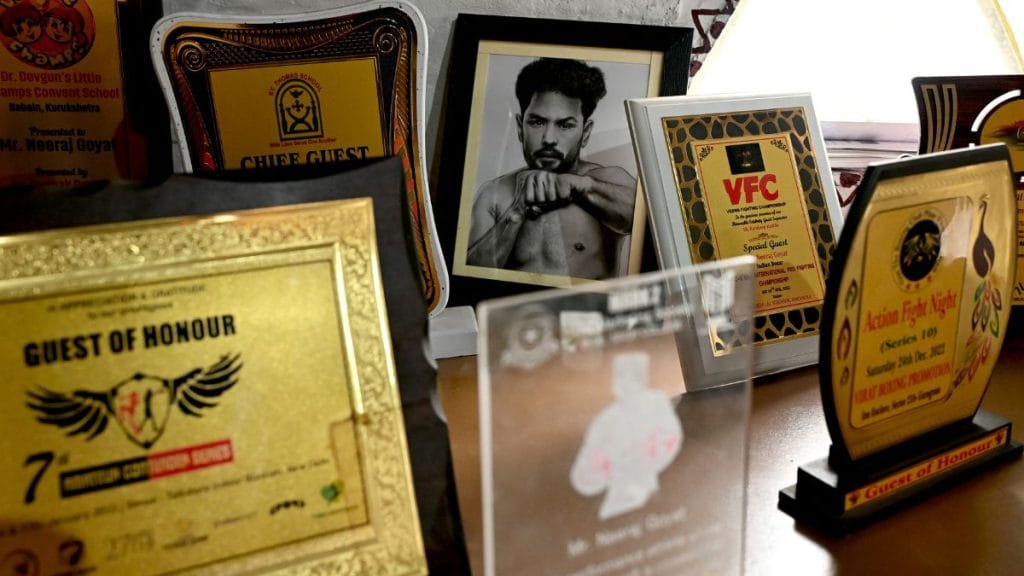 Several tables and walls in his meeting room are filled with trophies and photographs highlighting Neeraj Goyat’s achievements. Suraj Singh Bisht | ThePrint