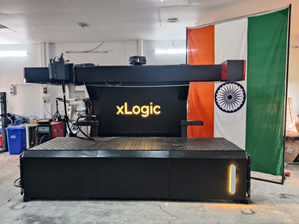 The tricolour shares space with an industrial machine at xLogic Labs 