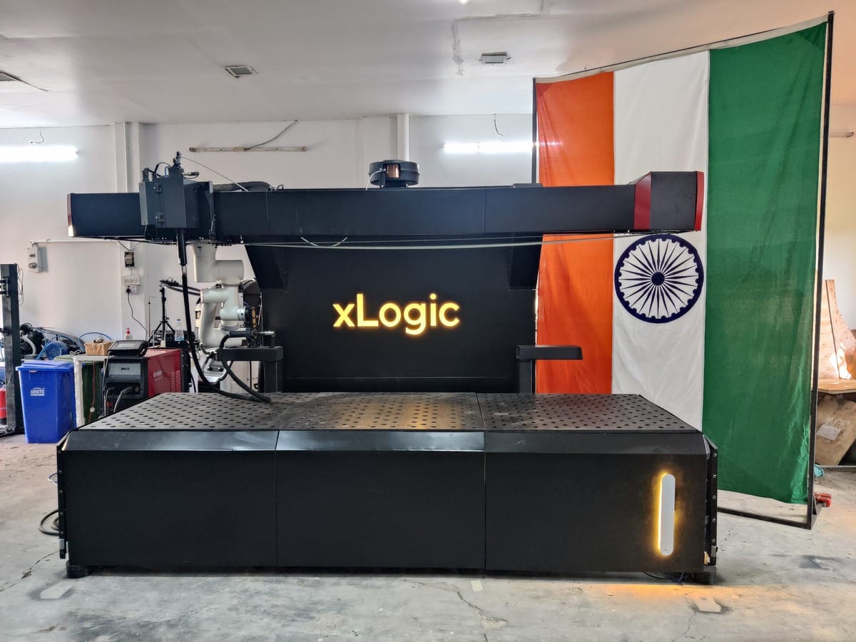 The tricolour shares space with an industrial machine at xLogic Labs