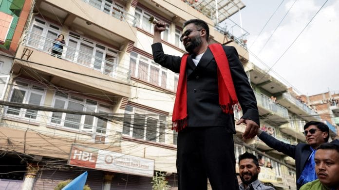 Balendra Shah, a rapper-turned-politician and the prime ministerial candidate for the Rastriya Swatantra Party (RSP), rings a bell, which is the party's symbol, as he takes part in an election campaign in Kirtipur, Kathmandu, Nepal, February 28, 2026. | REUTERS/Navesh Chitrakar