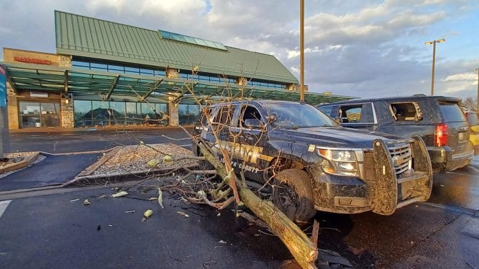 A fallen tree rests again a Sheriff's vehicle outside a hospital following storms and tornado warnings in Three Rivers, Michigan, U.S. March 6, 2026. | Dan Cherry/USA Today Network via REUTERS