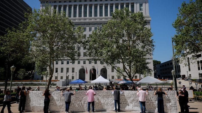 Parents who say they have lost their children due to social media hold up a banner with the names of the children outside the court after the jury found Meta and Google liable in a key test case accusing Meta and Google's YouTube of harming children's mental health through addictive social media platforms, in Los Angeles, California, U.S., March 25, 2026. REUTERS/Mike Blake