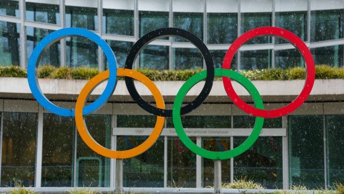 Olympic rings are pictured outside the International Olympic Committee (IOC) during an Executive Board meeting at the Olympic House in Lausanne, Switzerland, March 26, 2026. | REUTERS/Denis Balibouse