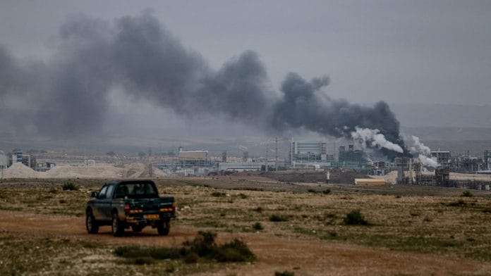 Smoke rises following an Iranian missile strike, as the U.S.-Israeli conflict with Iran continues, in Southern Israel, March 29, 2026. | REUTERS/Amir Cohen
