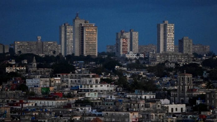 A view of sunrise as Cuba begins efforts to restore power after its grid collapsed for the second time in a week amid a U.S. oil blockade that has dealt a major blow to the island's already ailing energy infrastructure, in Havana, Cuba March 22, 2026. | REUTERS/Norlys Perez