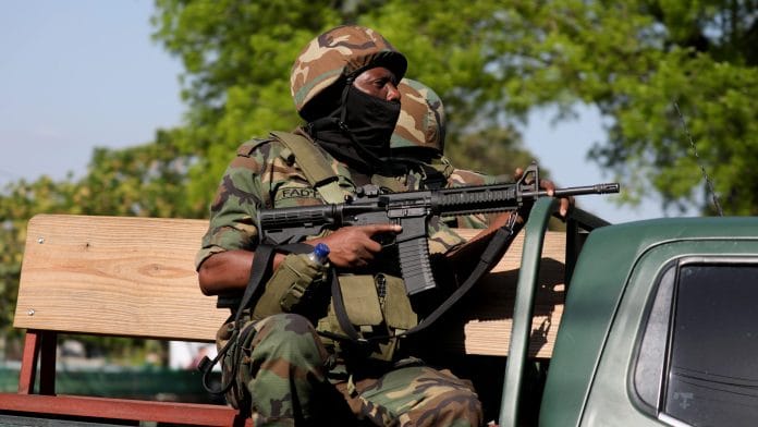 Law enforcement officers patrol amid ongoing gang violence, in this file photo from Haiti, March 19, 2025. | REUTERS/Ralph Tedy Erol/File Photo