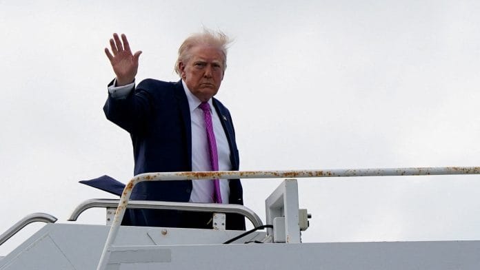 U.S. President Donald Trump waves as he boards Air Force One at Palm Beach International Airport in West Palm Beach, Florida, U.S., March 29, 2026. | REUTERS/Elizabeth Frantz/File Photo