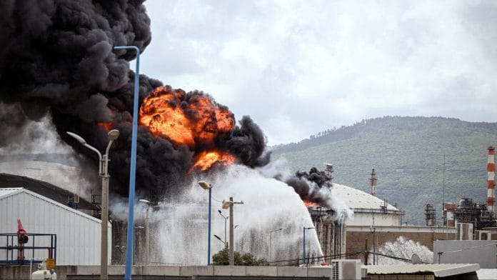A blaze after Israel's Fire and Rescue Service said that an industrial building and fuel tanker at Israel's Oil Refineries were hit by debris from an intercepted Iranian missile, in Haifa, Israel, March 30. | REUTERS/Rami Shlush