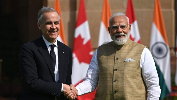 Mark Carney, left, shakes hands with Narendra Modi, in New Delhi, on March 2. Photographer: Prakash Singh/Bloomberg
