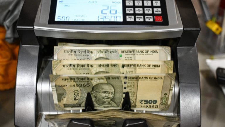 Rupee hits record low of Rs 92 per dollar, stocks and bonds slide as oil surge rattles markets