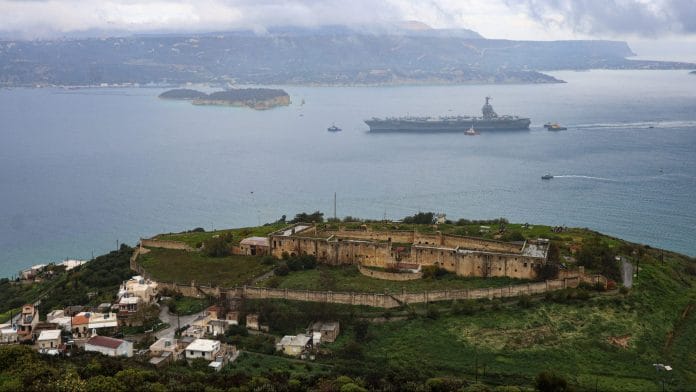 The USS Gerald R. Ford arrives at Souda Bay naval base on the island of Crete on March 23. | Photographer: Costas Metaxakis/AFP/Getty Images