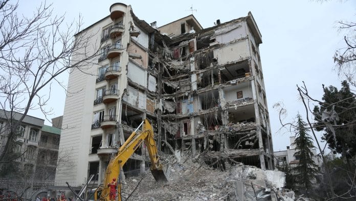A destroyed building in a residential area after joint US-Israeli strikes in Tehran, on March 23. | Photographer: Shadati/Xinhua/Getty Images