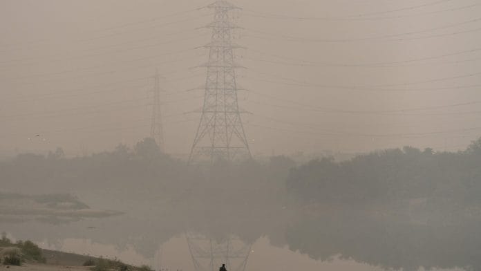 Air pollution shrouds electricity towers in New Delhi, India. | Bloomberg