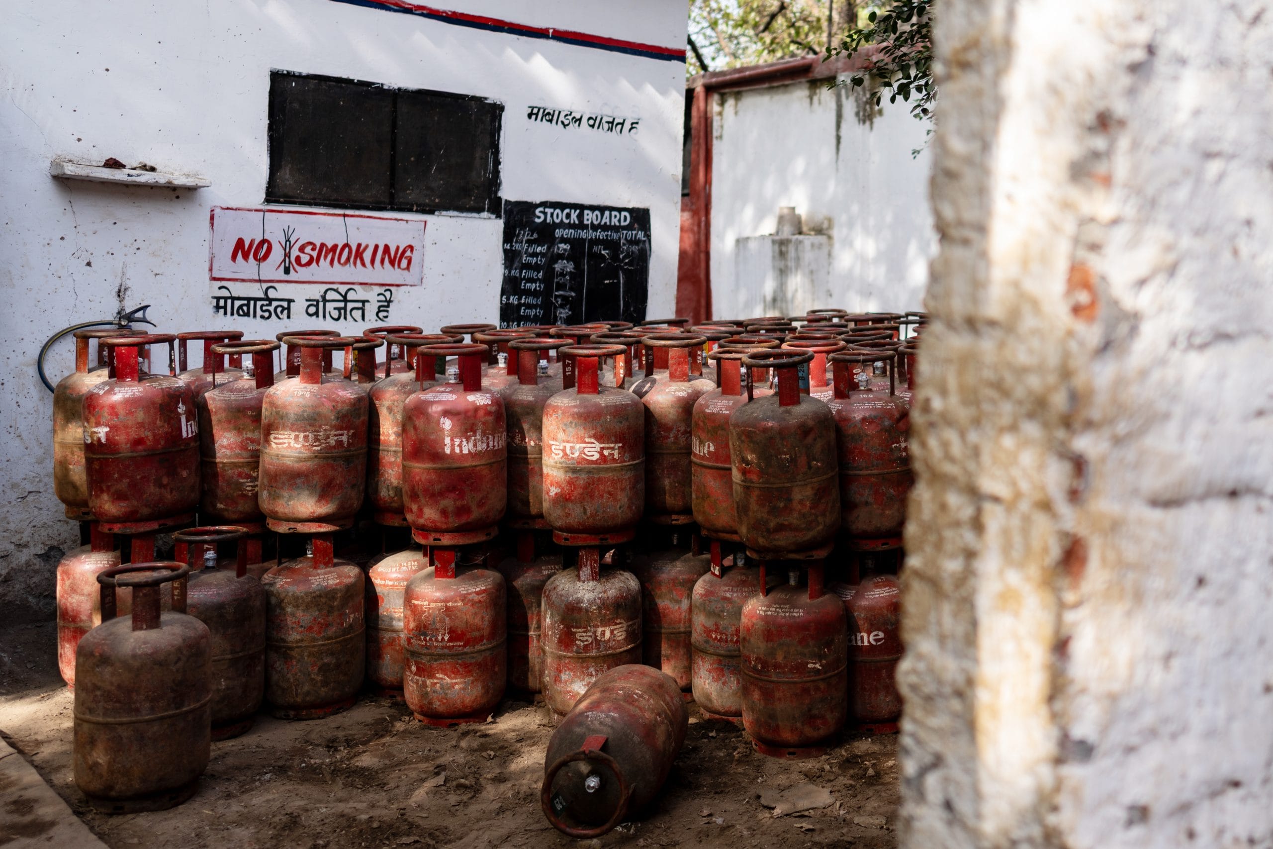 Canisters for LPG at a depot in New Delhi. | Photographer: Anindito Mukherjee/Bloomberg