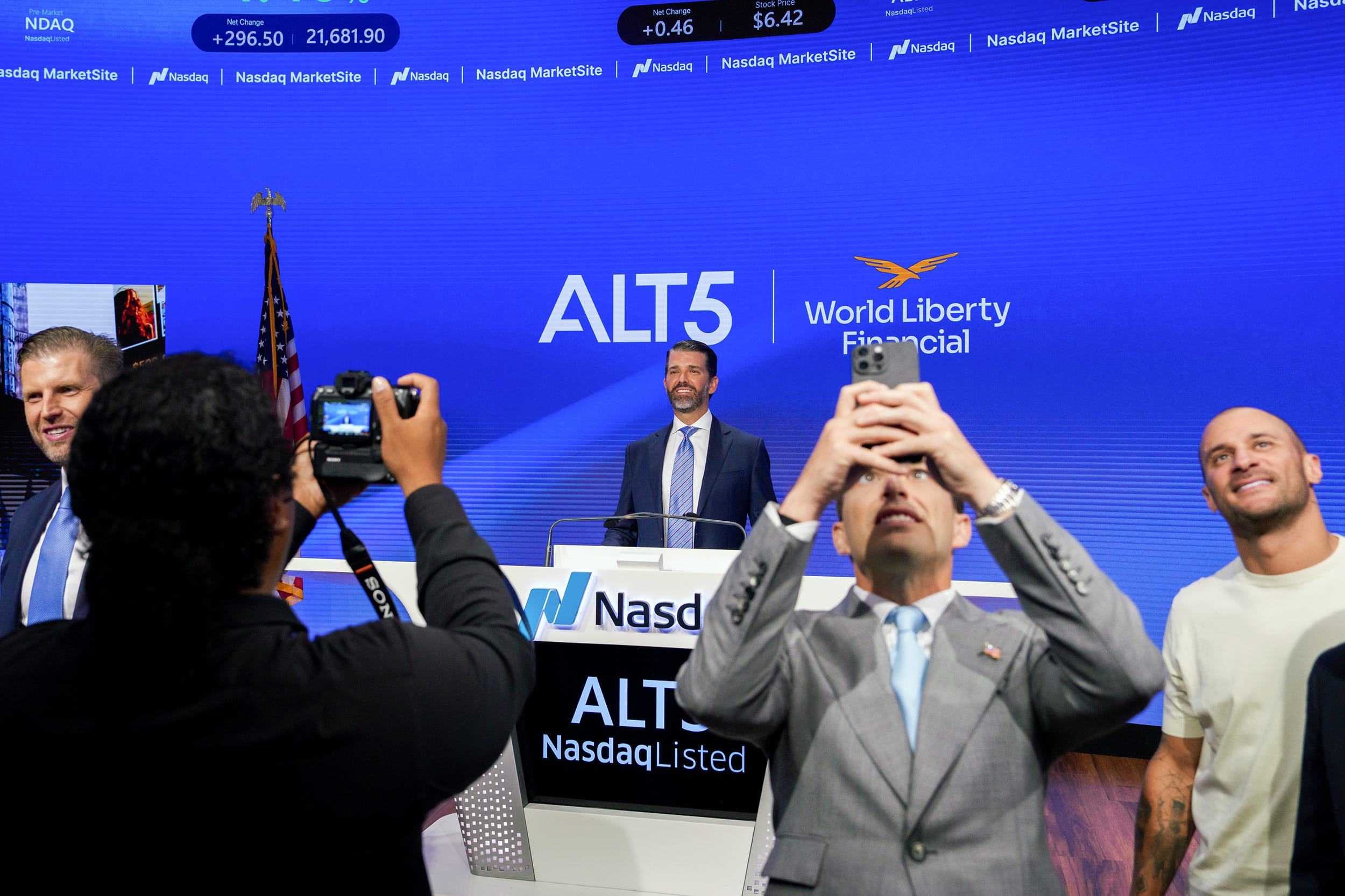 Eric Trump, from left, Donald Trump Jr., Zachary Witkoff, and Chase Herro, co-founder of World Liberty Financial, at the Nasdaq Market Site in New York, on Aug. 13. | Photographer: Adam Gray/Bloomberg