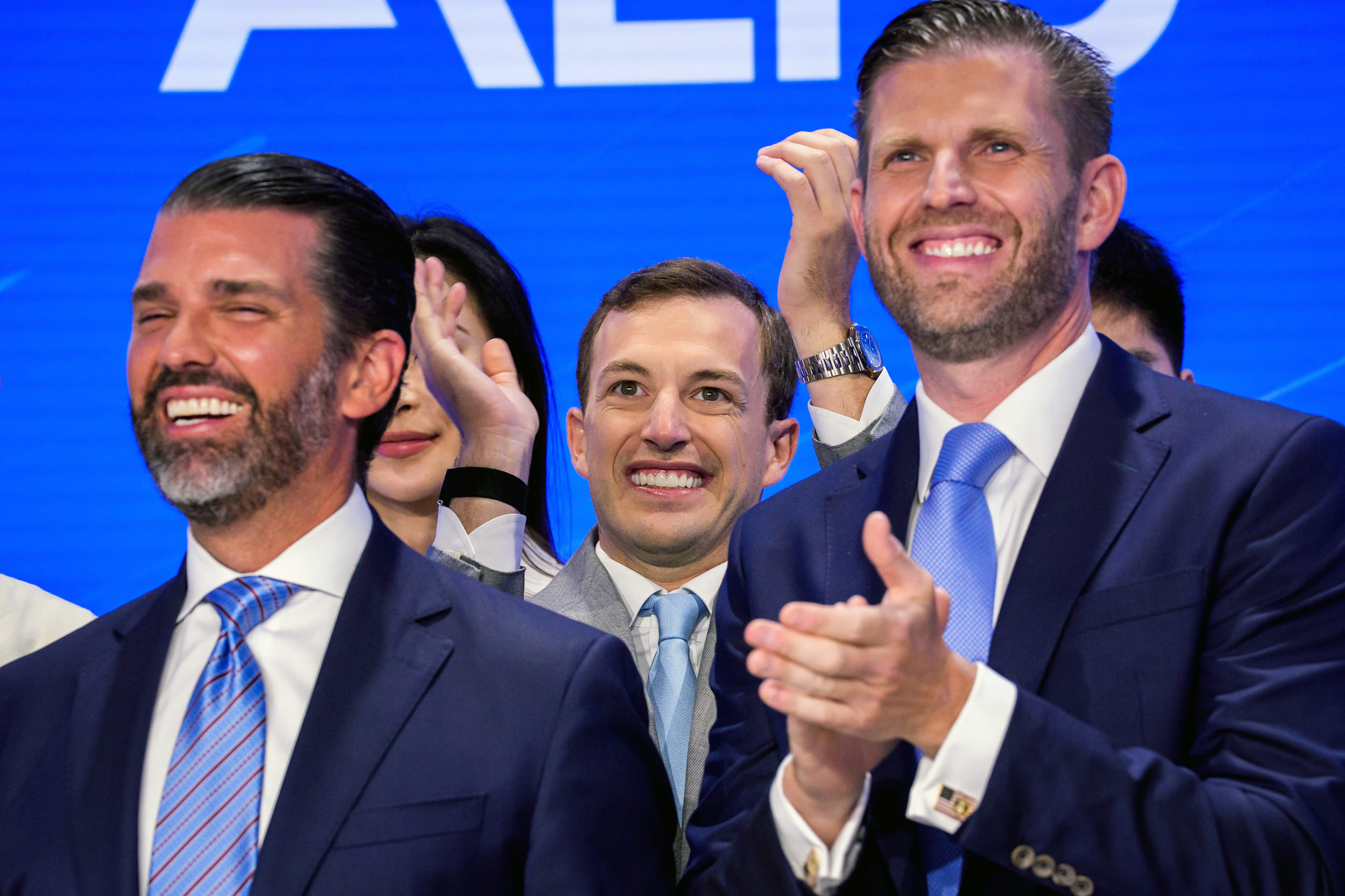 Zachary Witkoff stands by Donald Trump Jr. and Eric Trump as they celebrate a World Liberty Financial deal during the opening bell at Nasdaq in New York on Aug. 13. | Photographer: Adam Gray/Bloomberg