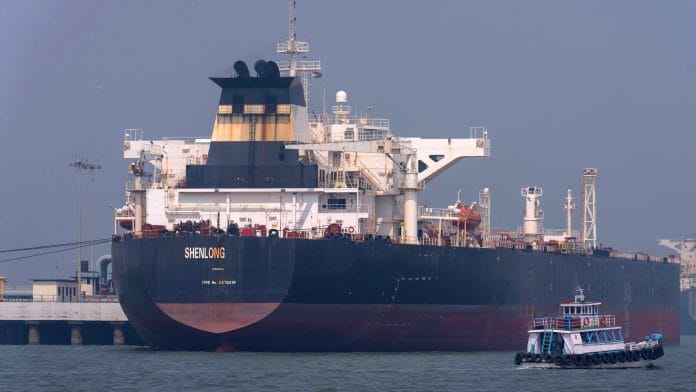 Liberia-flagged tanker Shenlong Suezmax, carrying crude oil from Saudi Arabia, that arrived clearing the Strait of Hormuz, is seen at the Mumbai Port in Mumbai, India, Thursday, March 12, 2026. | AP/PTI