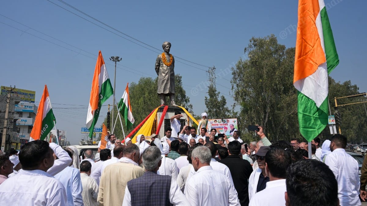Congress workers with Brijendra Singh at Sir Chhotu Ram Chowk | Suraj Singh Bisht | ThePrint