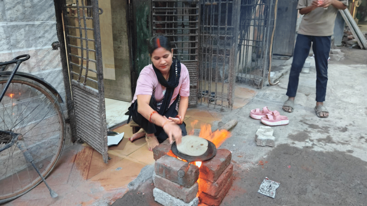 With LPG supplies hit, Surat textiles industry workers' families have moved to make-shift chulhas for cooking meals. | Esha Mishra/ThePrint