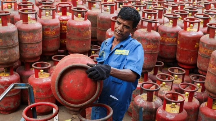 A man loads LPG cylinders onto a cart at a warehouse in Mumbai on 11 March 2026 | Francis Mascarenhas/Reuters