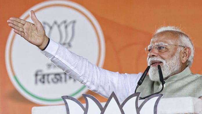 **EDS: THIRD PARTY IMAGE** In this image posted on March 14, 2026, Prime Minister Narendra Modi addresses the gathering during a rally, at Brigade Parade Ground in Kolkata. (narendramodi.in via PTI Photo) (PTI03_14_2026_000199B)