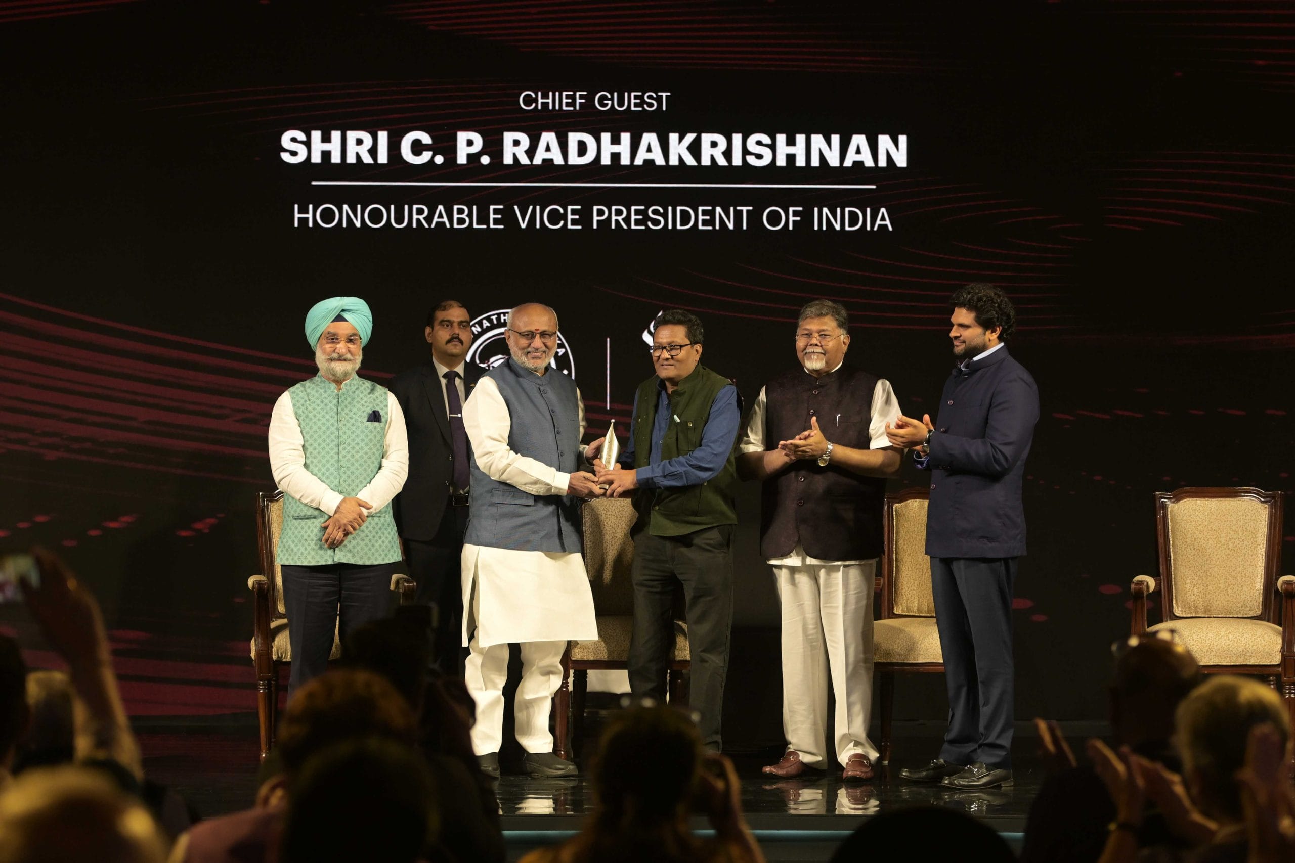 ThePrint's National Photo Editor, Praveen Jain, being awarded the Ramnath Goenka Excellence in Journalism award by Vice President CP Radhakrishnan in New Delhi on 27 March 2026 | Suraj Singh Bisht | ThePrint
